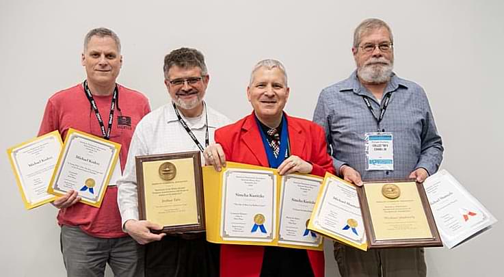 First place exhibit award winners during the National Money Show, from left: Michael Kodysz, Joshua Tate, Simcha Kuritzky, and Michael Shutterly.