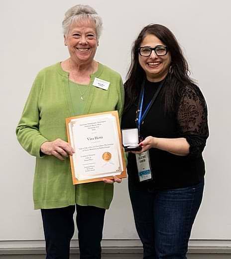 2026 National Money Show exhibit award winners - ANA Governor Donna Moon (left) presents Vira Hora with her third place exhibit award