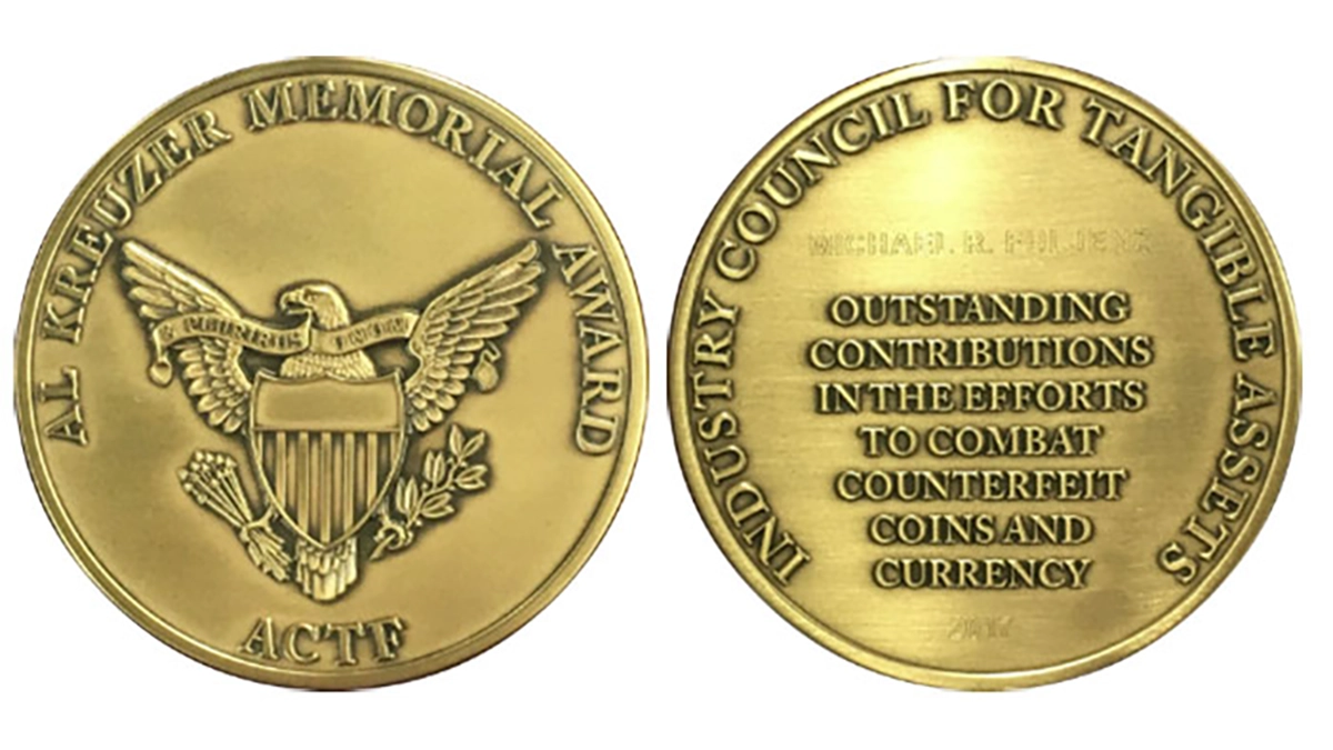 Front and back of the Al Kreuzer Award.