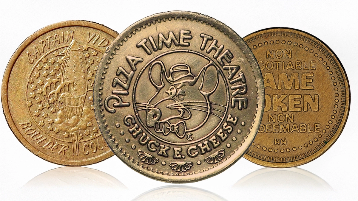 This is an image of three videogame Arcade Tokens.