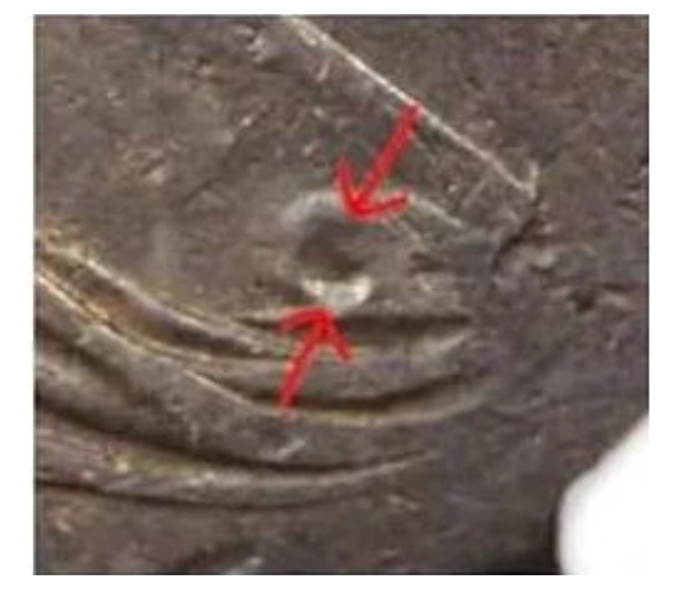 “Bust crater” common to all of the counterfeits.