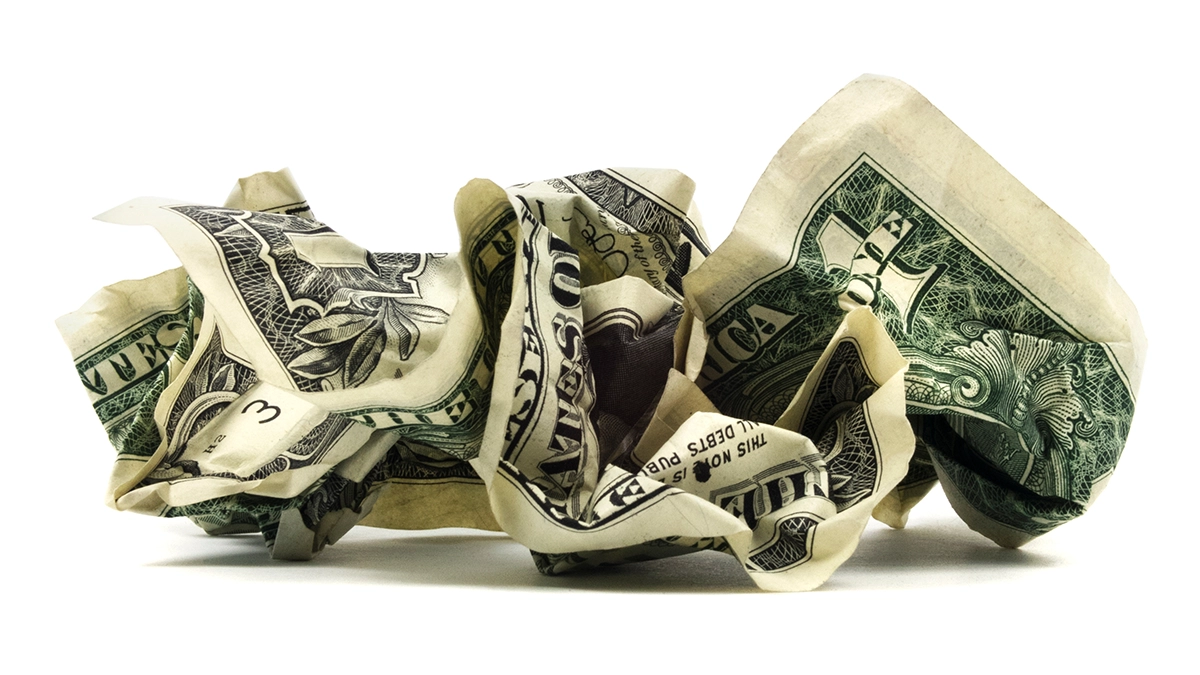 This is an Adobe Stock image of a crumpled dollar.