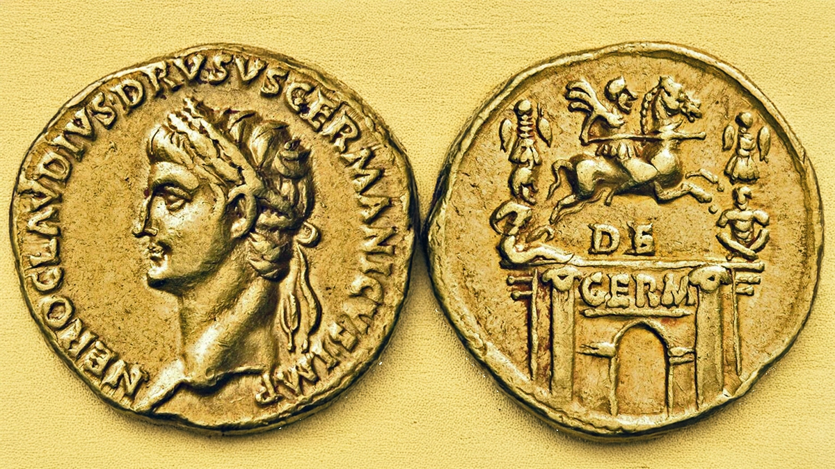Figure 4: Nero Claudius Drusus, Died 9 BC. Aureus (7.82 g.), minted under Claudius, Rome, 41-45 CE. Laureate head of Nero Drusus to left. Reverse: Triumphal arch surmounted by an equestrian statue of Nero Drusus galloping to right between two military trophies, each with a bound captive seated below. RIC 69.