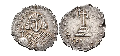 Theodosius III of Adramytium, 715-717. Hexagram (Silver, 21 mm, 3.18 g, 6 h), struck from solidus dies, Constantinople, 715. d N ThEOdO-SIЧS MЧL A' Crowned facing bust of Theodosius II, wearing loros, holding a globe surmounted by patriarchal cross with an X at the intersection in his right hand and an anexikakia in his left. Rev. VICTORIA AЧSЧ I/ CONOB Cross potent on base and three steps. DOC 2 note. MIB 12. SB 1491. Extremely rare. With clear traces of overstriking on a hexagram of Anastasius II, otherwise, about extremely fine.