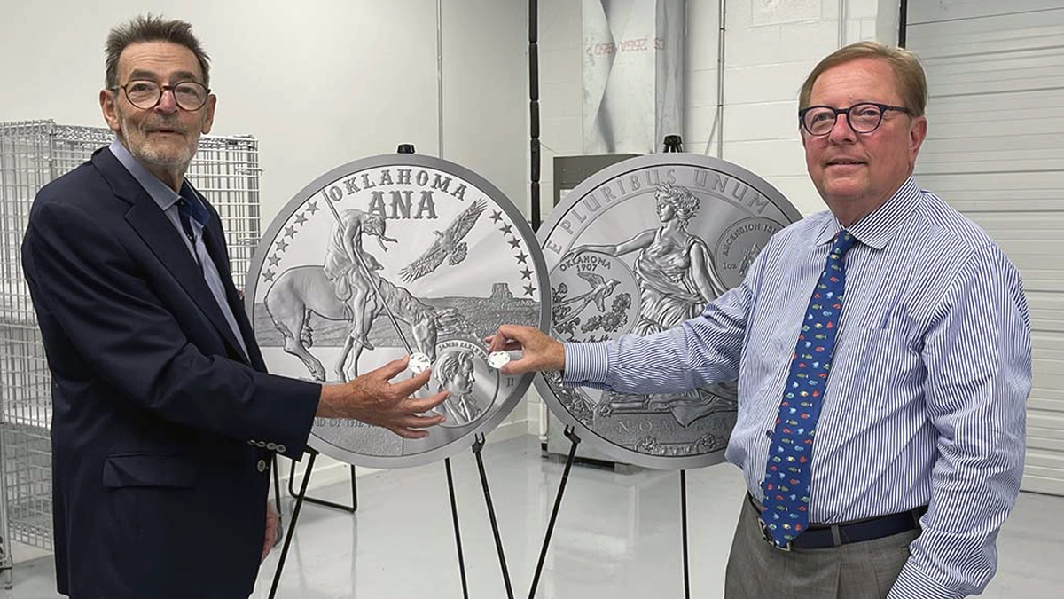This is an image of Joel Iskowitz (left) and Tom Uram (right) holding up newly struck 2025 ANA Show Eagles.