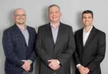 Devin Hipp and Keith Moon Launch Numismatic Rarities Exchange (NREX) in Collaboration with DLRC This is an image of Devin Hipp, Keith Moon, and Kyle Honoré.