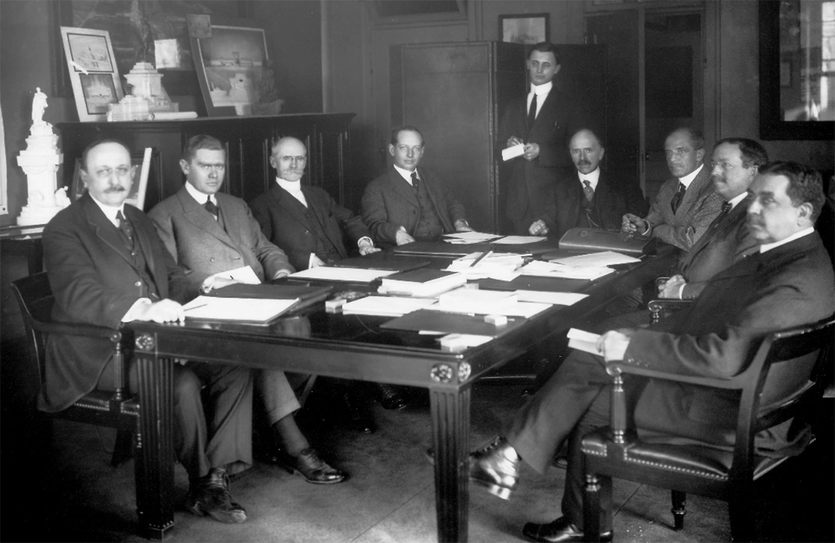 Figure 1. Group photo of the Commission of Fine Arts taken between 1912 and 1915. Left to right: Cass Gilbert, Pierce Anderson, Edwin H. Blashfield, Frederick Law Olmsted, Arno B. Caemmerer (clerk, standing), Col. William W. Harts (secretary), Daniel Chester French (chairman), Thomas Hastings, Charles Moore. No group photo was taken in 1921. (Courtesy Commission of Fine Arts.)
