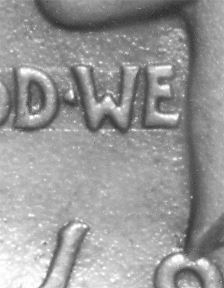 Figure 2. Detail of original obverse cast of Peace dollar. Note rough surface and guideline below motto. (Photo by Bill Fivaz.)